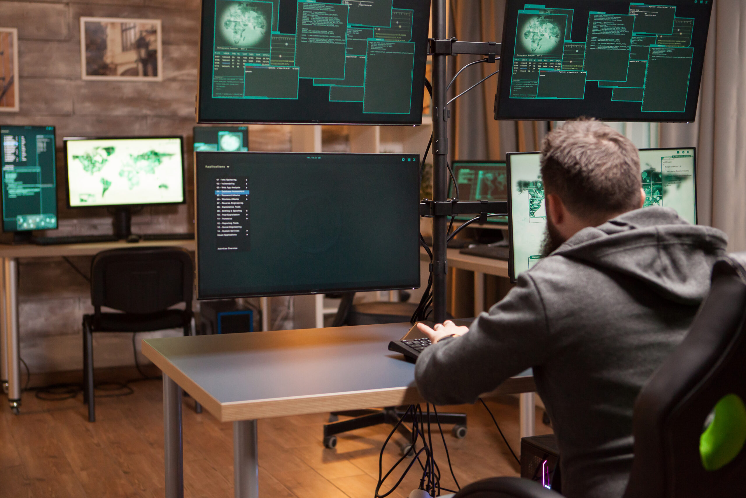 shot from the back of dangerous hacker making a dangerous virus