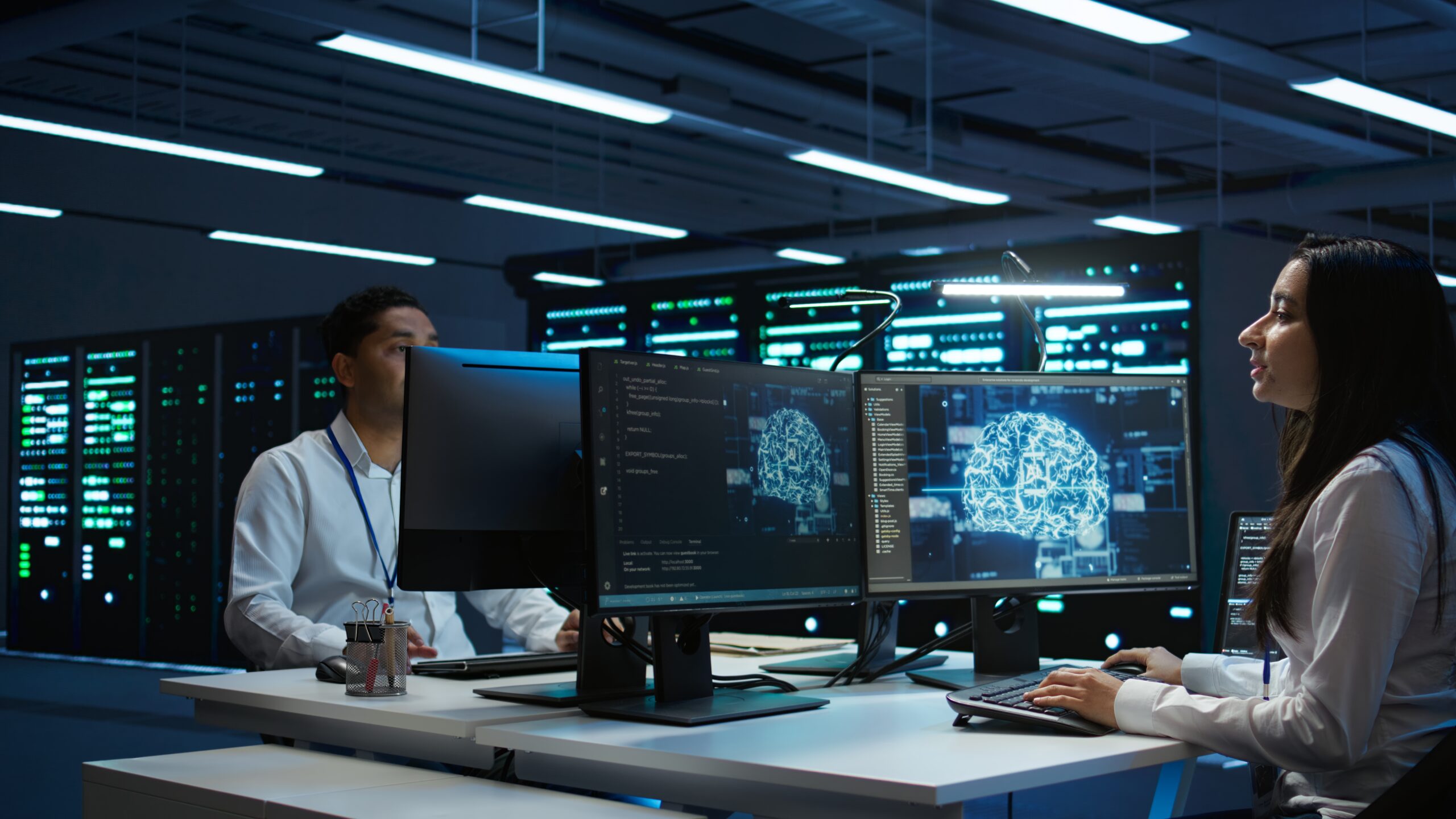 team of engineers using ai tech on computer to do checkup in server room